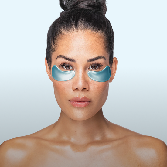 A woman using a Nano Gold Repair Collagen Eye Mask.