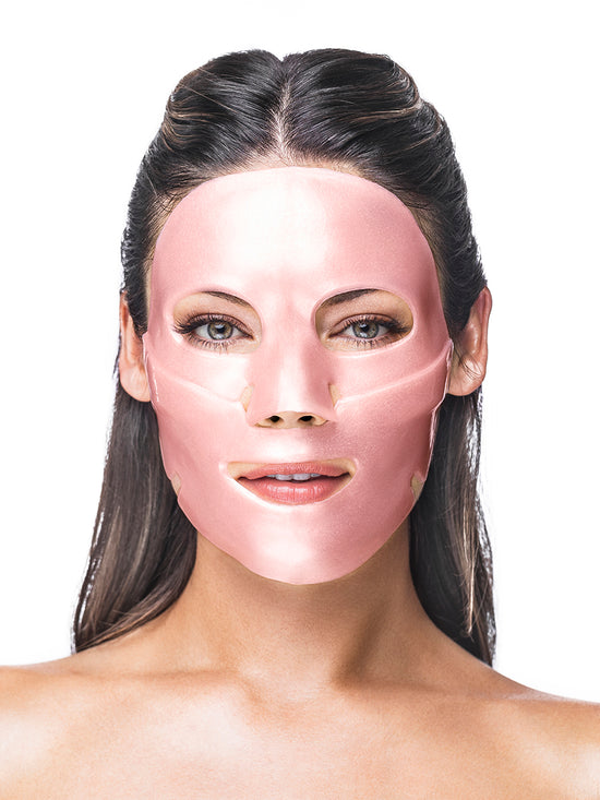 Woman wearing a pink face mask on a white background