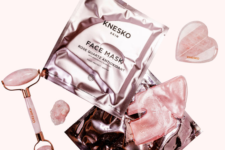 Knesko skincare products including face masks, roller, and heart-shaped gua sha on a white background