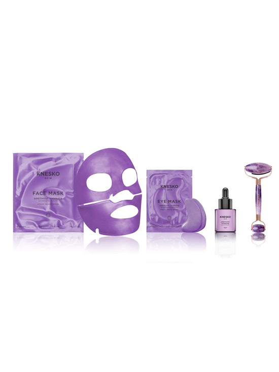 Set of Knesko skincare products including face mask, eye mask, serum, and roller on a white background