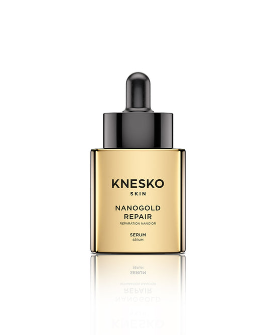 Gold repair serum bottle on a white background