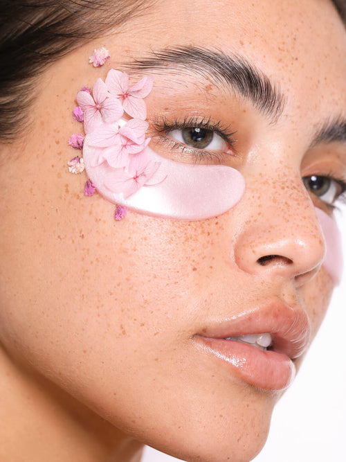 Woman wearing knesko rose eye masks