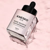 pink serum bottle that says knesko skin rose quartz antioxidant serum.