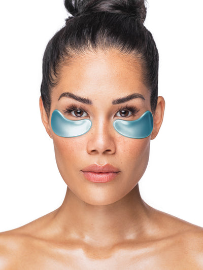 Woman wearing blue eye masks on a white background