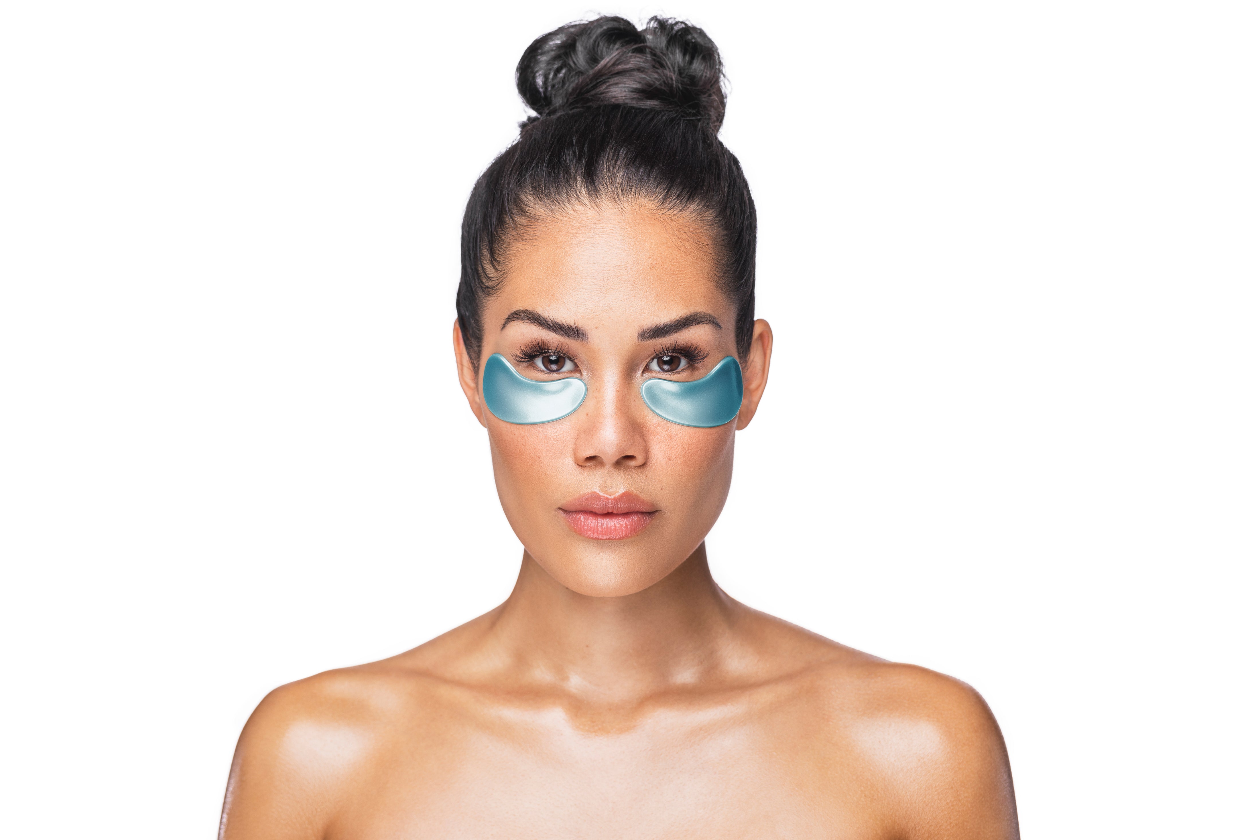 Woman wearing blue eye masks on a white background
