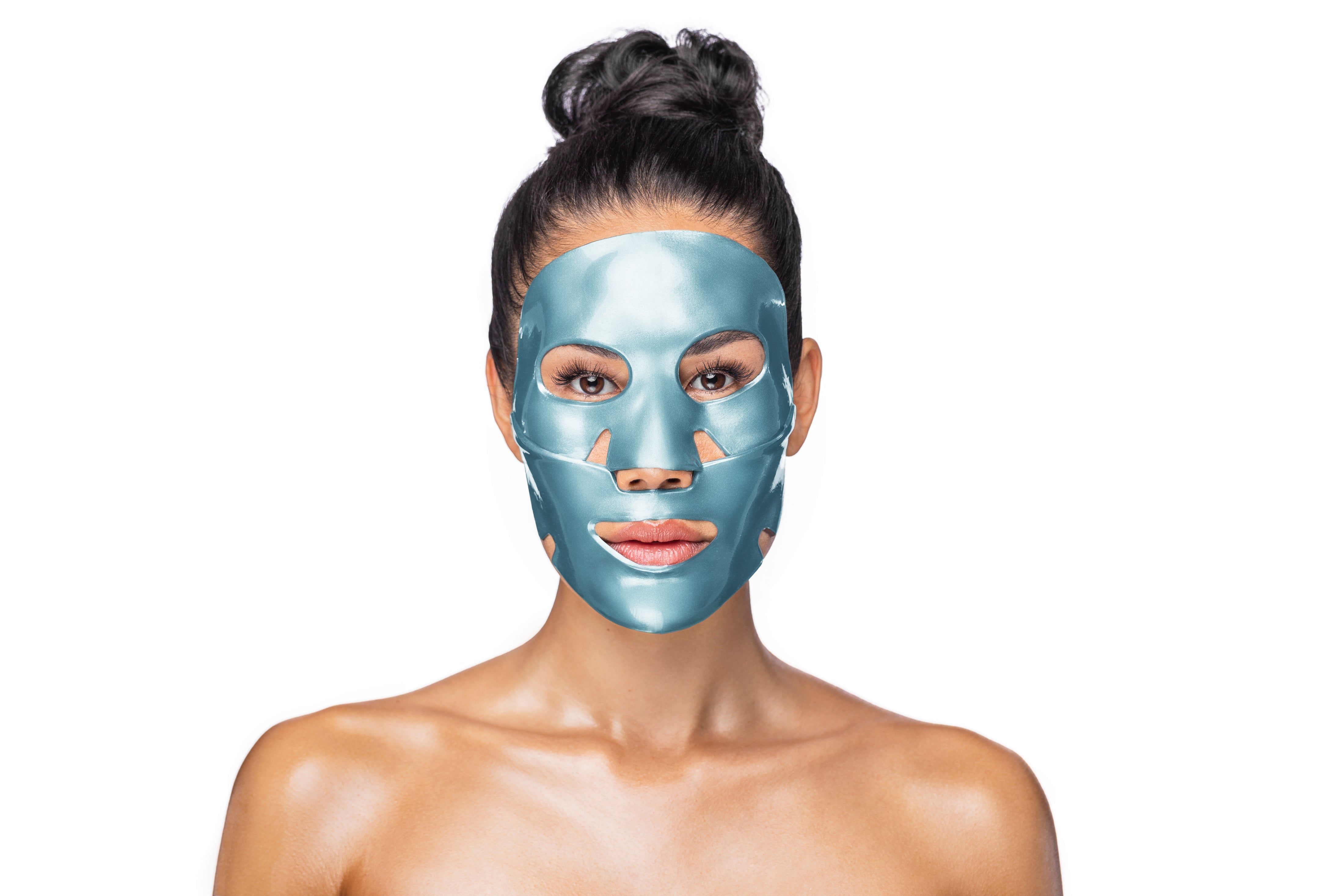 Woman wearing a blue face mask against a white background