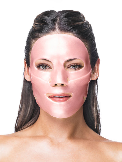 Woman wearing a pink face mask on a white background