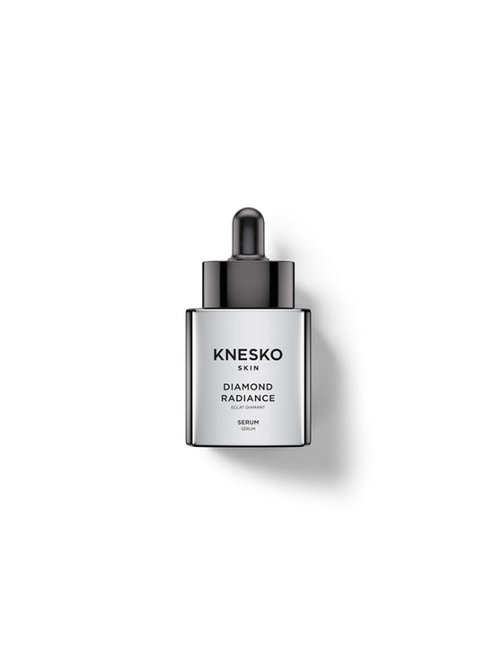 Knesko Skin Diamond Radiance Serum in a sleek silver rectangular bottle with a black dropper cap, centered on a clean white background with a soft shadow.