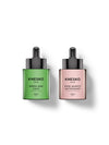 Two Knesko Skin serum bottles on a white background, one in green labeled Green Jade Calm and one in pink labeled Rose Quartz Antioxidant.