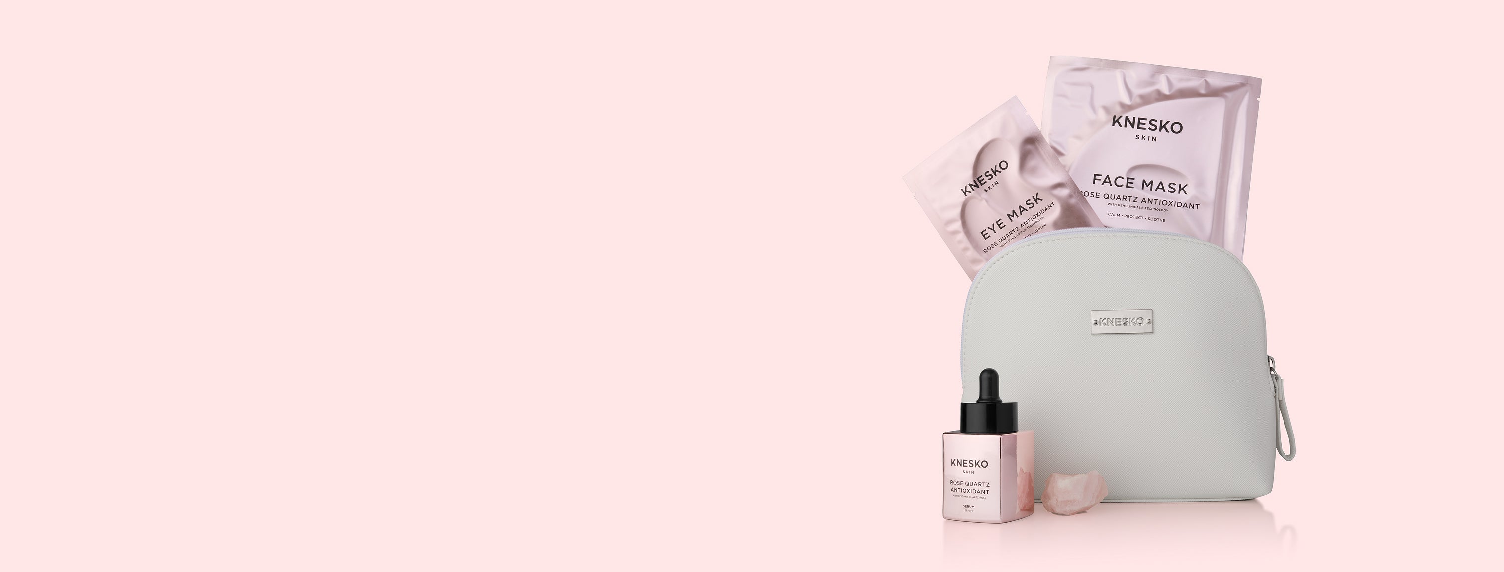 Knesko skincare products including face mask, eye mask, and serum on a pink background