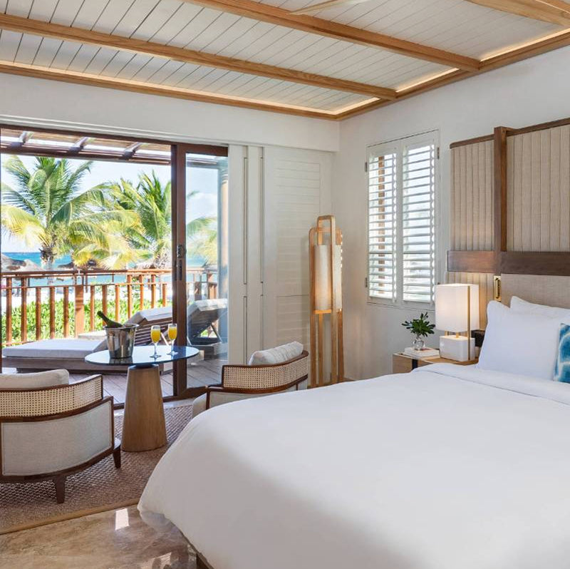 Luxury bedroom with a view of a tropical outdoor area