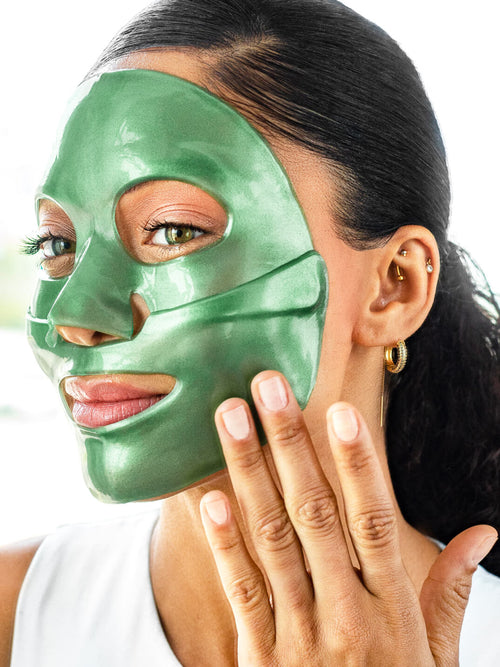 Woman wearing green jade knesko eye masks