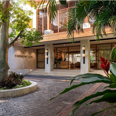 Fairmont Spa entrance with greenery and a modern building facade