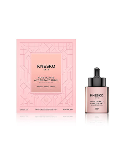 pink serum bottle that says knesko skin rose quartz antioxidant serum next to its box.@30ML Serum